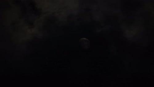 Full Moon Shines with Rolling Dark Clouds
