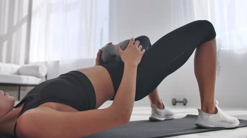 Woman Working Out Indoors With Weight
