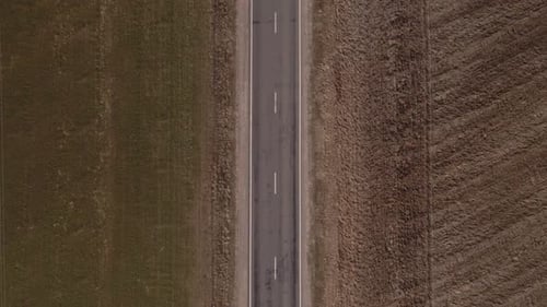 Truck Driving on Road Along the Fields Aerial View