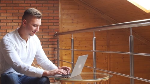 Portrait of Happy Young Businessman Works at Home Office