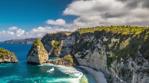 Scenic Rocks on a Cloudy on Atuh Beach at Nusa Penida Island, Indonesia