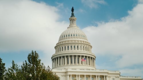 The Dome of the Recognizable Capitol Building in Washington, DC. Against the Blue Sky and Clouds