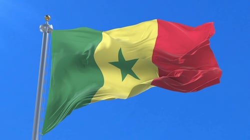 Realistic Senegal National Flag Waving in Wind on Blue Sky