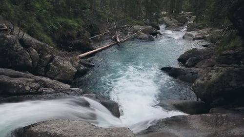 Mountain River with Cascade Waterfall in Forest