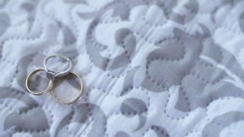 Wedding Rings on White Quilt, Close Up
