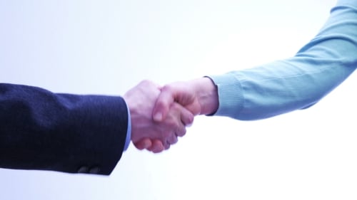 Business People Shaking Hands Against White Background