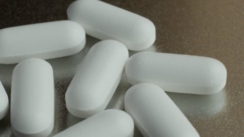 Close Up of Pharmaceutical Pills on Metal