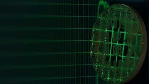 Bitcoin Token with Green Digital Graph Background