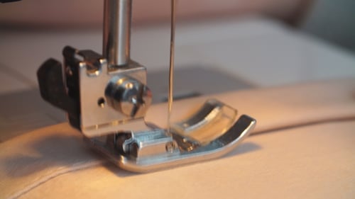 Sewing Machine Stitches Light Peach Fabric Seam
