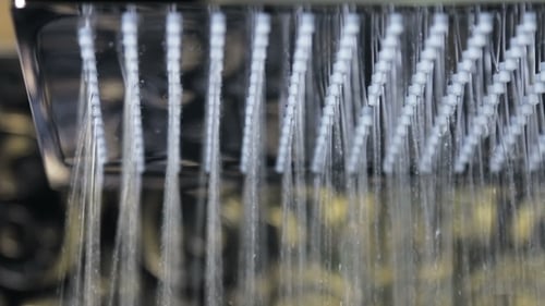 Modern Shower Head Streaming Water Close Up