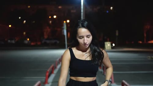 Trendy Female Walking on Parking Lot