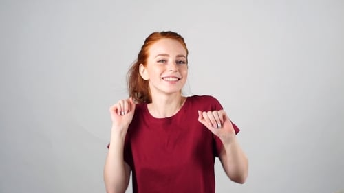 Smiling Woman Dancing with Red Hair