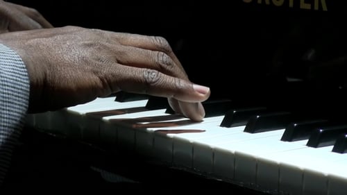 Close Up of Hands Playing Piano Keyboard