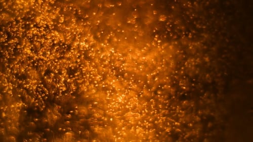 Abstract Golden Particles Shimmering Background Effect