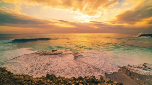 Cliff and Ocean Against the Background of an Colorful Sunset in Island Nusa Lembongan, Bali