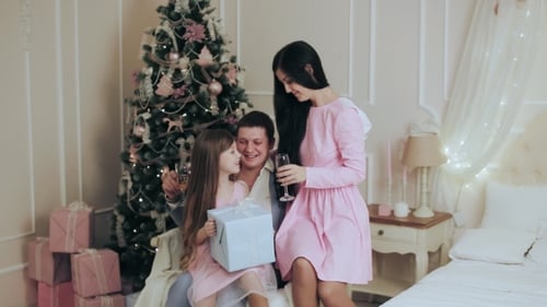 Family Celebrates Christmas Together at Home
