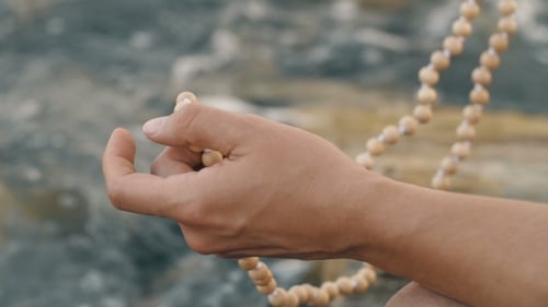 Counting Mala Prayer Beads by a Gentle River