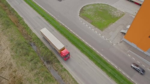 Truck Rides Through Industrial Area