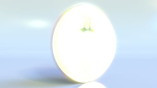 Realistic Shiny Bitcoin Token Spins Across the Frame and Stops