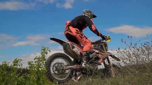Dirt Bikes Jumping in the Rural Countryside