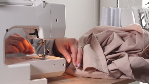 Sewing Machine Stitching Beige Fabric Close Up