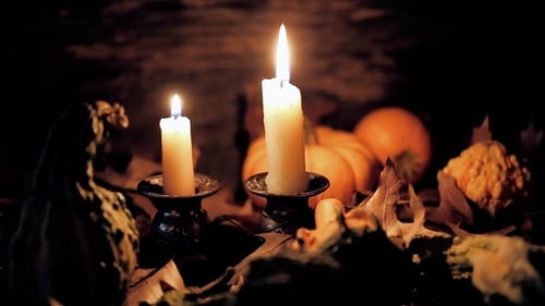 Candles Burning with Pumpkins and Autumn Leaves