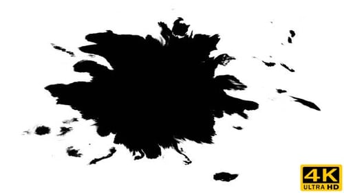 Black Ink Blot Expanding Across White Surface