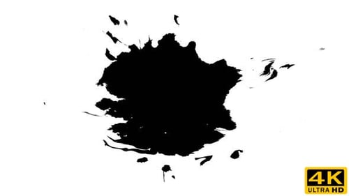 Black Ink Blot Spreads Across White Surface