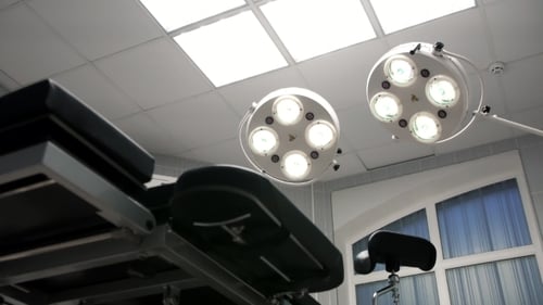 Empty Operating Room with Surgical Lights and Table