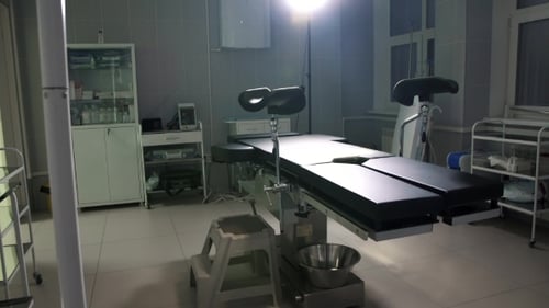 Hospital Examination Room with Examination Table and Equipment