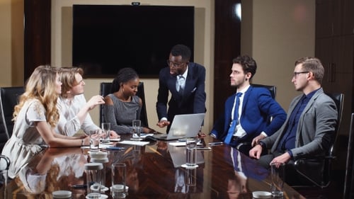 Diverse Team Collaborates at a Modern Conference Table
