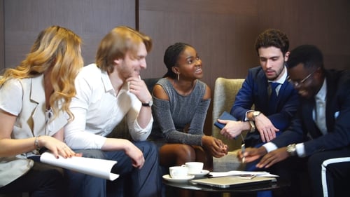 Business Team Discusses Documents in an Office Setting