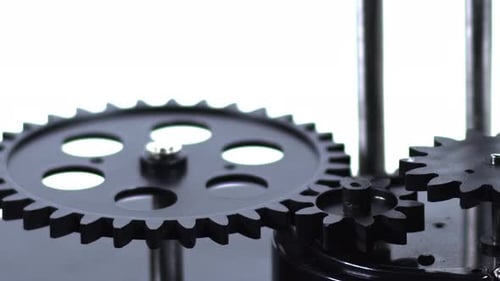 Close Up of Intricate Black Gears Turning