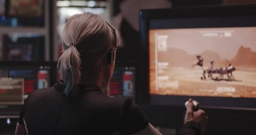Woman Controls Mars Rover in Futuristic Workspace