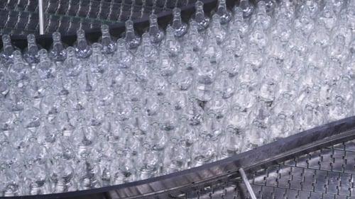 Bottles on Conveyor Belt in Factory