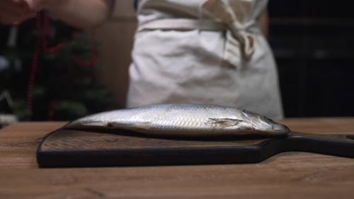 Raw Fish on Cutting Board at Christmastime