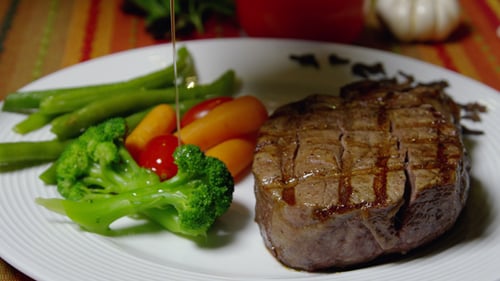 Juicy Steak with Fresh Vegetables Close Up