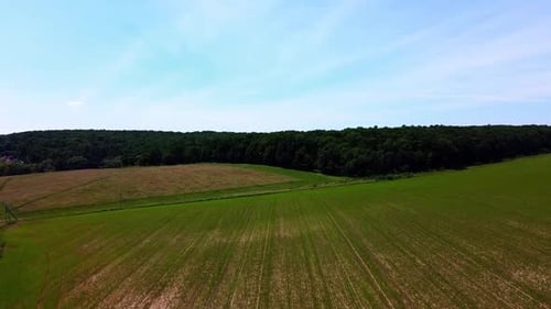 Aerial drone view of a flying over the rural agricultural landscape.