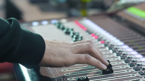 Audio Mixer in a Studio Ready for the Recording