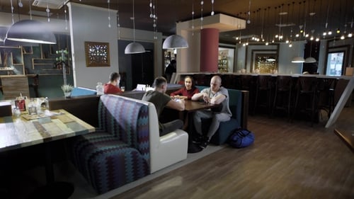 a Company of Friends Is Resting in a Restaurant After a Hard Nurse