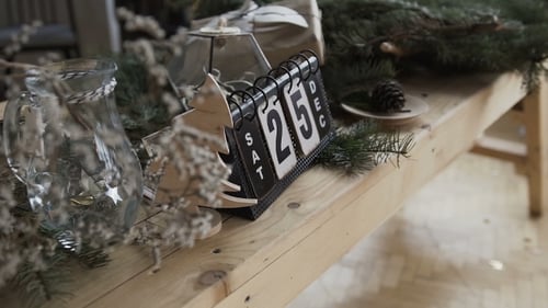 Christmas Decorations and Calendar on Wooden Table