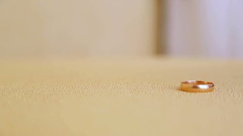 Unique Case. Two Wedding Rings Hit One Another and Fall One on One.