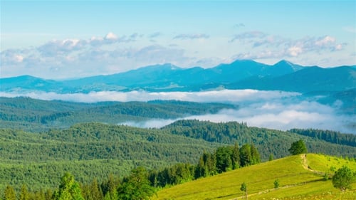Majestic Mountain Landscape with Foggy Valleys