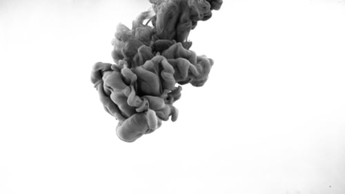 Black Ink Spreading Through Clear Water