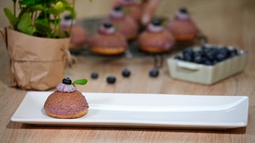 Put in White Plate Cream Puff with Craquelin. Cream Puff with Craquelin and Whipped Cream.