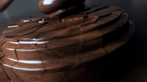 Dramatic Gavel Strike Shattering Block with Luminous Reveal