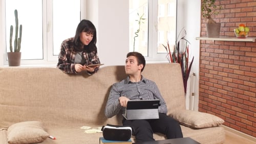 Couple Working on Tablets Together at Home