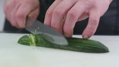 Cucumber Slicing on Cutting Board Close Up