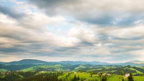 of Blue Sky with Clouds Over Mountain