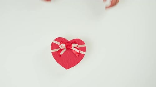 Red Heart Present with White Ribbon Bow